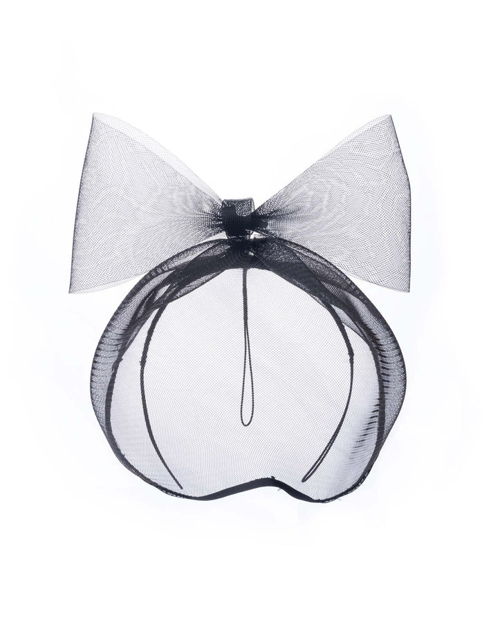 A black mesh cage-style constructed mask. On top of the cage-style mesh mask, there is a mesh bow. The mask is fitted with a thin headband. The mask is perfect for high-fashion events or special parties. Made by Merve Bayindir Millinery.