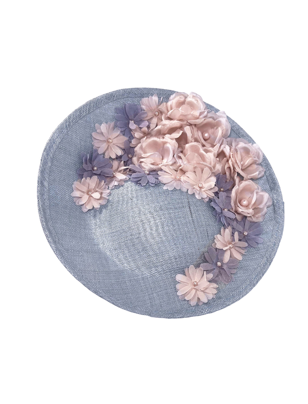 Blue straw hat with pink and purple floral decorations on a white background