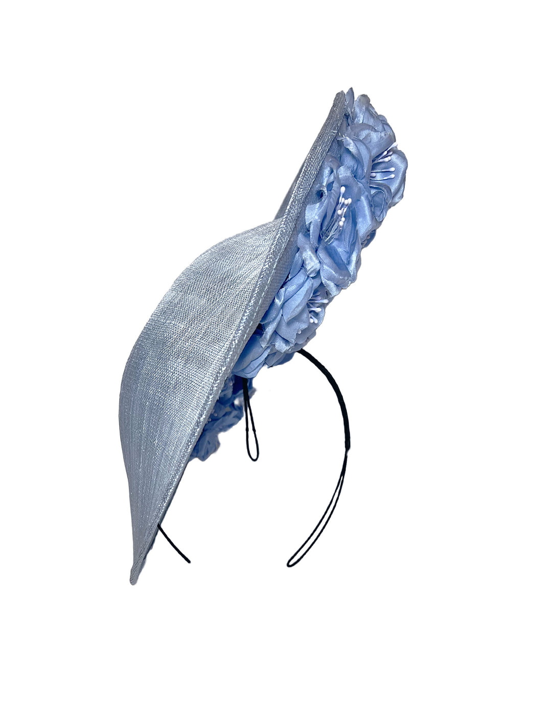 Blue decorative headband with ruffled top on a white background