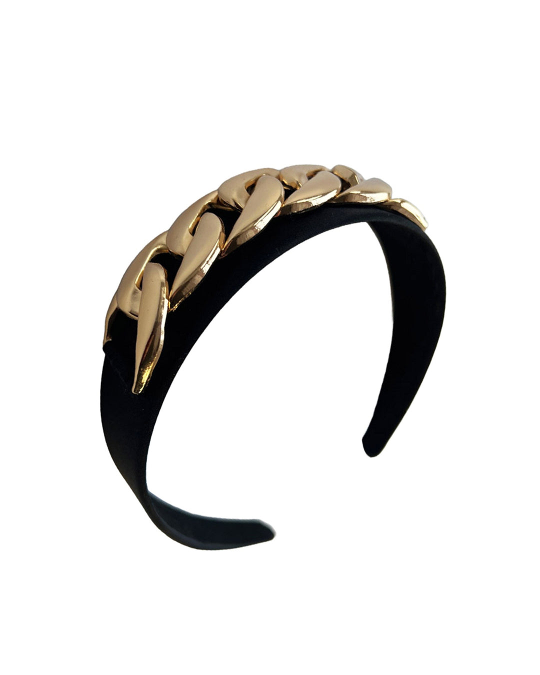 Still life picture of the Celeste Headband, handcrafted from a satin black Alice headband and crowned with a statement gold chain. Designed by Merve Bayindir.