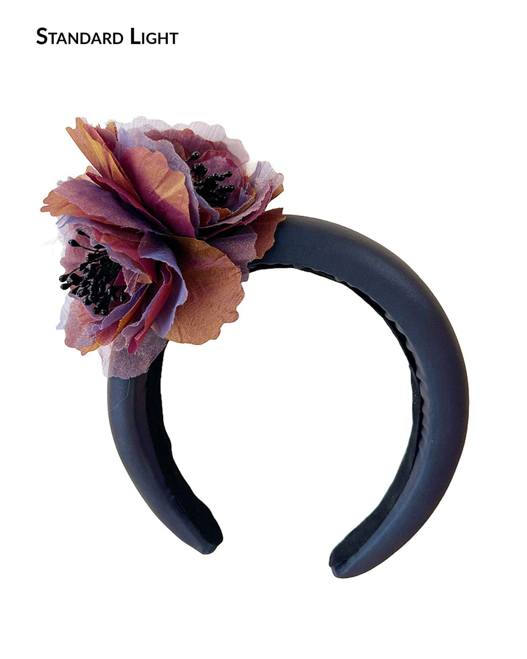 Product shout of Eclipse Headband in standard lighting, showing rich purple padded band with handcrafted mulberry and bronze flower, couture headband by Merve Bayindir.