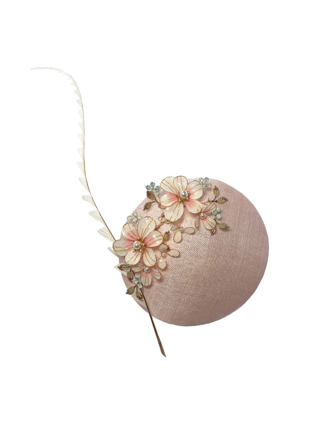 Pink fascinator with floral decorations on a white background