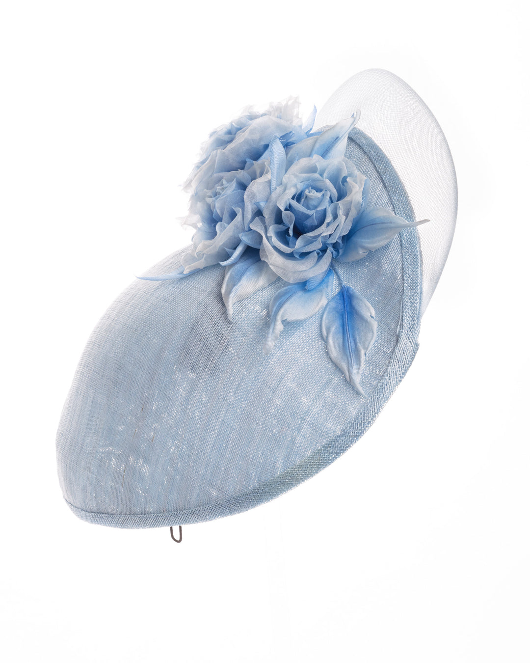 Powder blue sinamay fascinator with a sculpted teardrop silhouette, adorned with layered chiffon roses and matching soft leaves for an elegant, romantic finish. Designed and made by Merve Bayindir Millinery.

