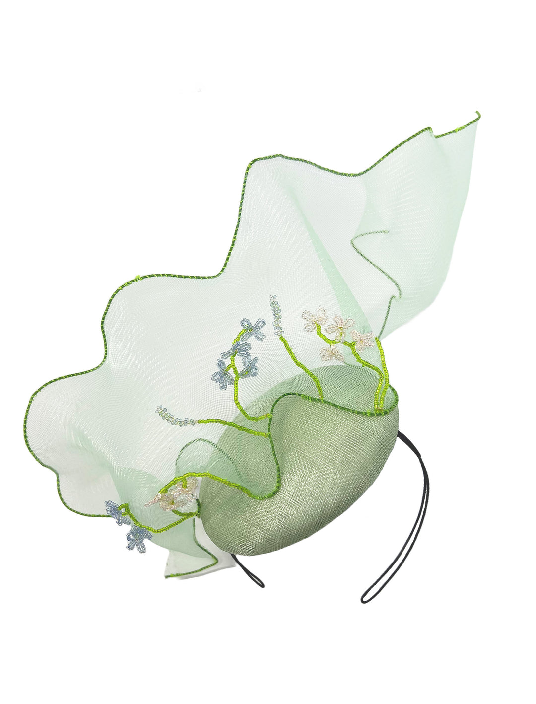 Green decorative headpiece with floral details on a white background