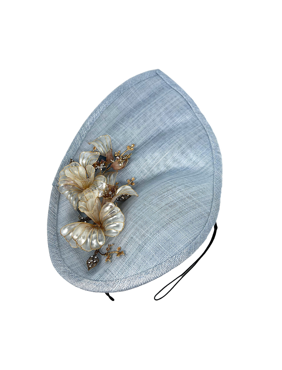 Light blue decorative hat with floral embellishments on a white background