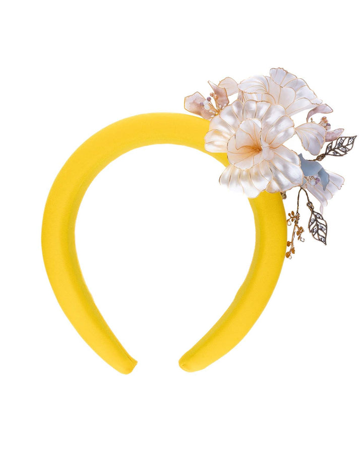 High yellow headband decorated with wired sheer resin flowers and small metal adornments. Made by Merve Bayindir. Made in UK.