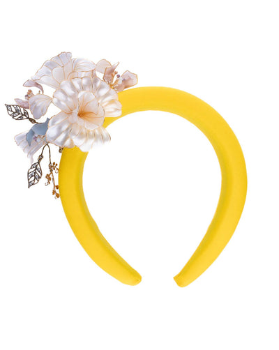 High yellow headband decorated with wired sheer resin flowers and small metal adornments.