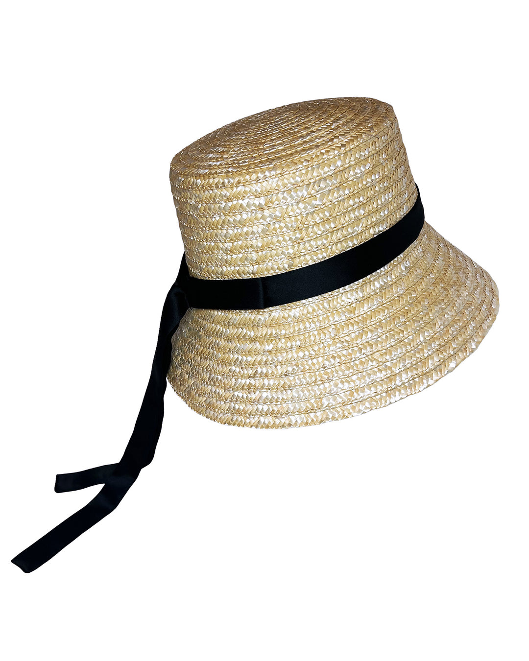 Natural woven straw bucket hat with a softly sloping brim, finished with a black ribbon band and long trailing ties at the side. Designed and Made by Merve Bayindir millinery.