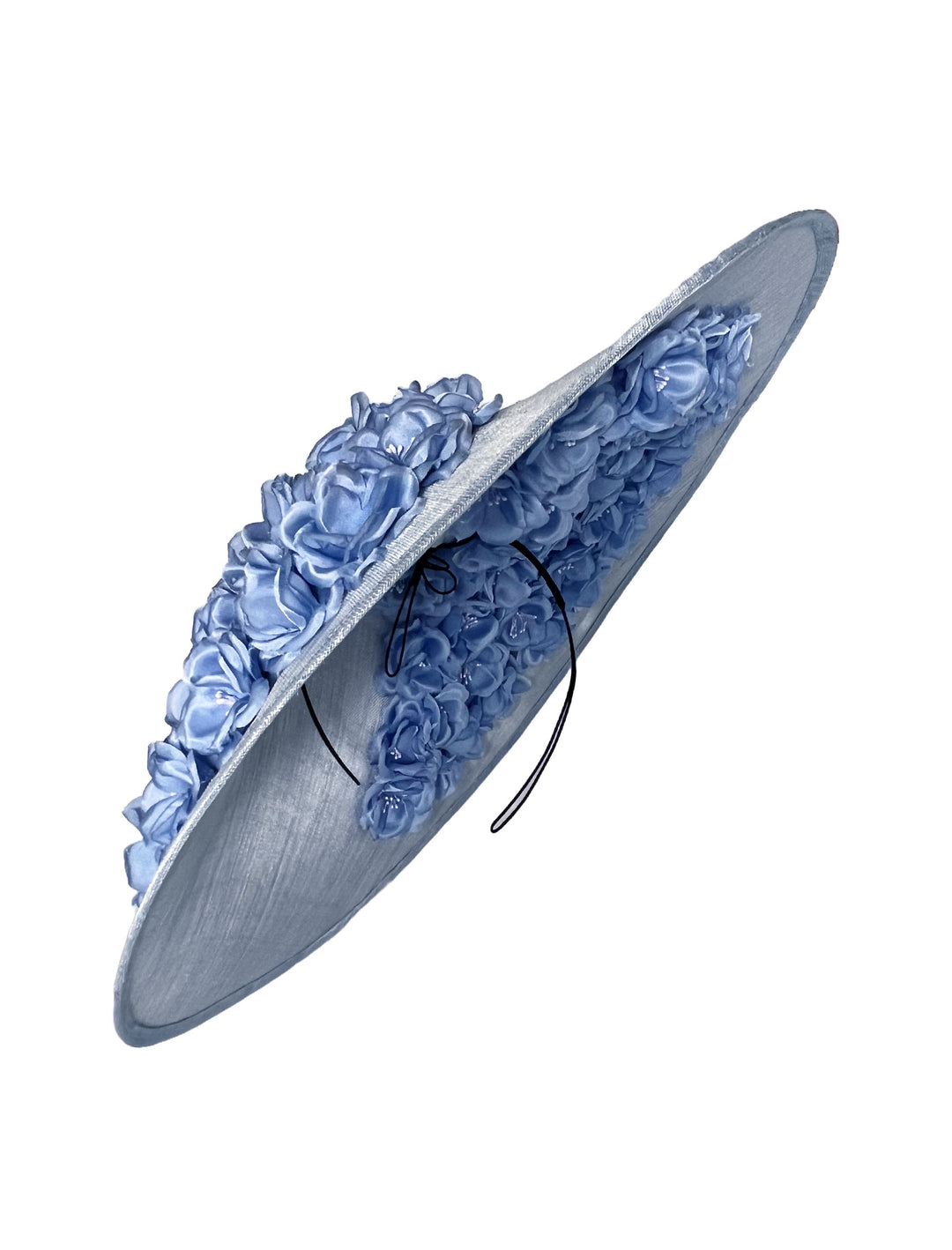Blue decorative hat with floral embellishments on a white background