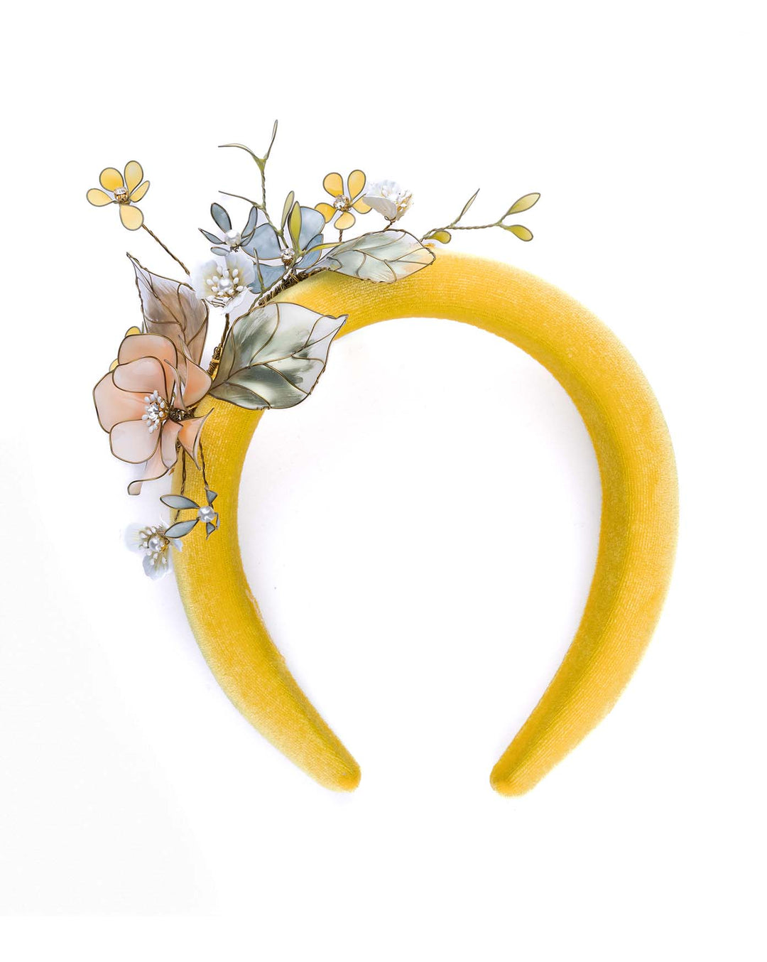Still life picture of high yellow velvet luxury headband decorated with medium sized multi colour resin flower bouquet, made by Merve Bayindir Millinery