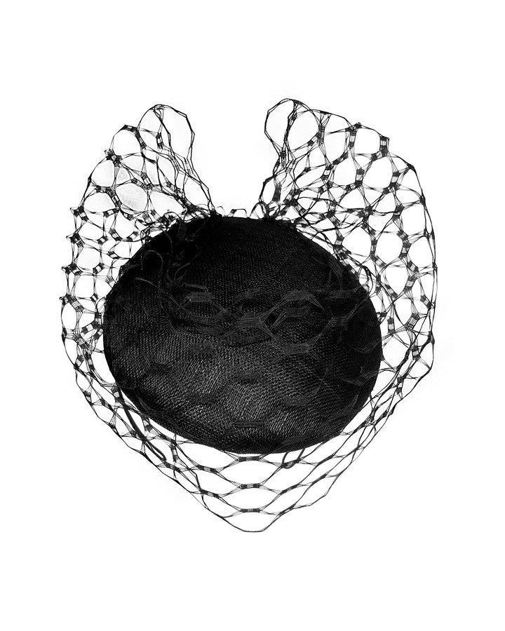 Black round fascinator crafted from sinamay woven material, topped with sculpted looped detailing and framed by a dramatic open birdcage veil that flares outward on both sides. Designed and made by Merve Bayindir Millinery.
