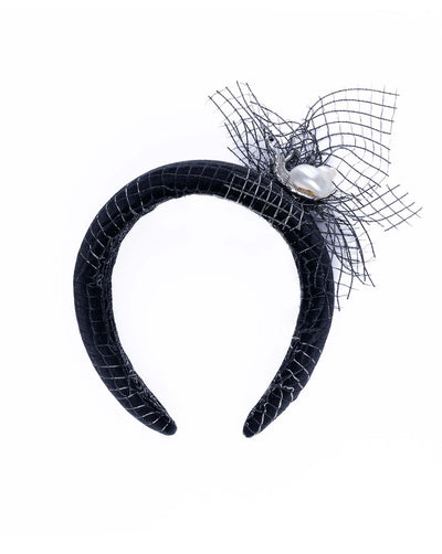 Black Velvet High Headband, covered with a silver black mix net fabric. It is embellished with a net fabric flower and a mother of pearl detailed snail brooch.