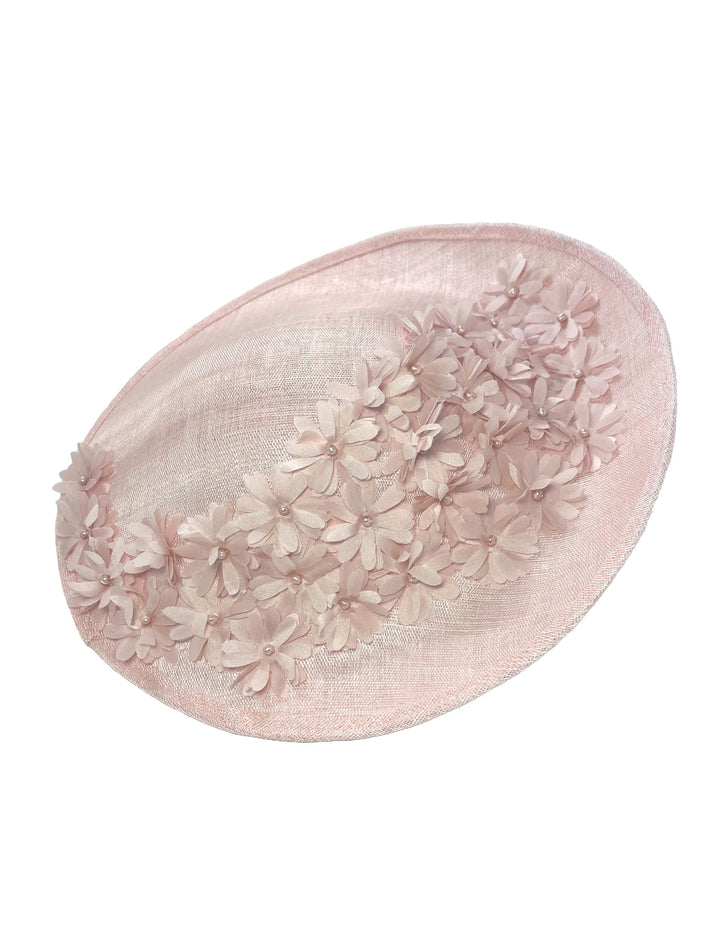 Pink decorative item with floral patterns on a white background