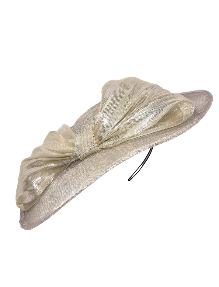 Beige hat with a large bow on a white background