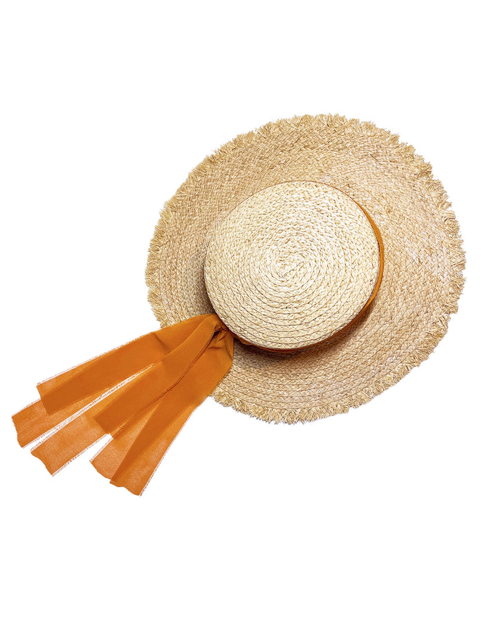 Natural woven straw boater hat with a wide frayed brim, accented with long sheer orange ribbon ties at the back. Designed and Made by Merve Bayindir millinery.