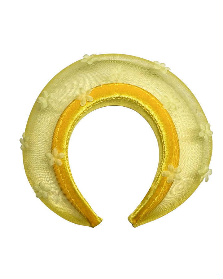 Lemon yellow headband fascinator featuring a satin-covered base encircled by a sheer structured halo, embellished with small tonal floral appliqués for a light, textured finish. Designed and made by Merve Bayindir Millinery.

