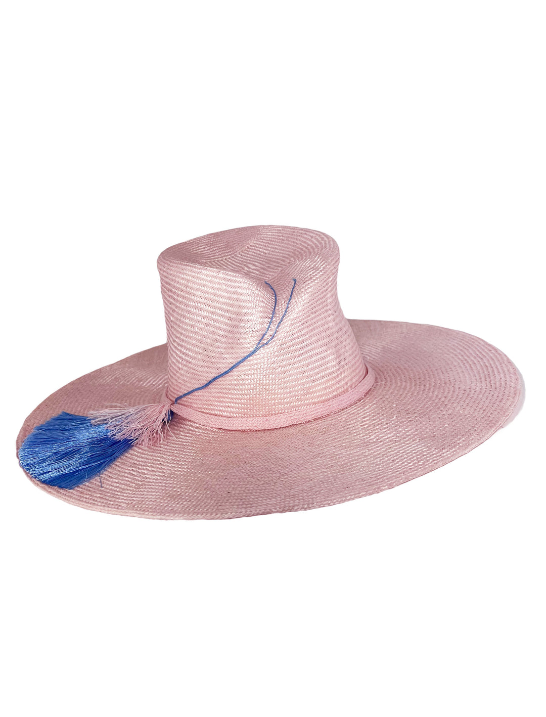 Pink straw hat with a blue feather on a white background