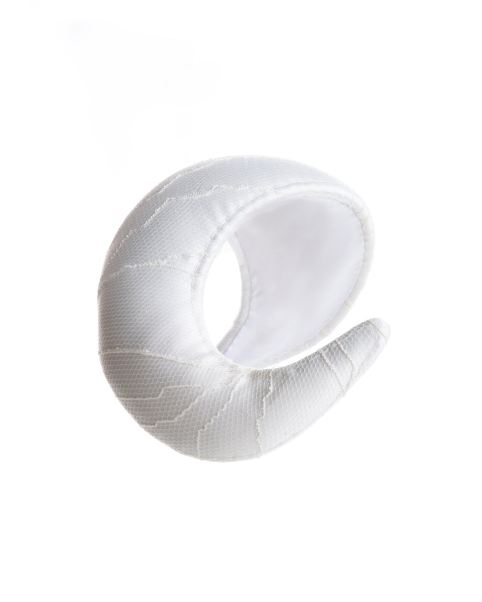  “S” shaped sateen bridal headband covered with a sheer tulle with glitter. The asymmetric piece curves upwards, hugging the head while getting thicker from one side to the other.  The artistic headband is perfect for modern brides.