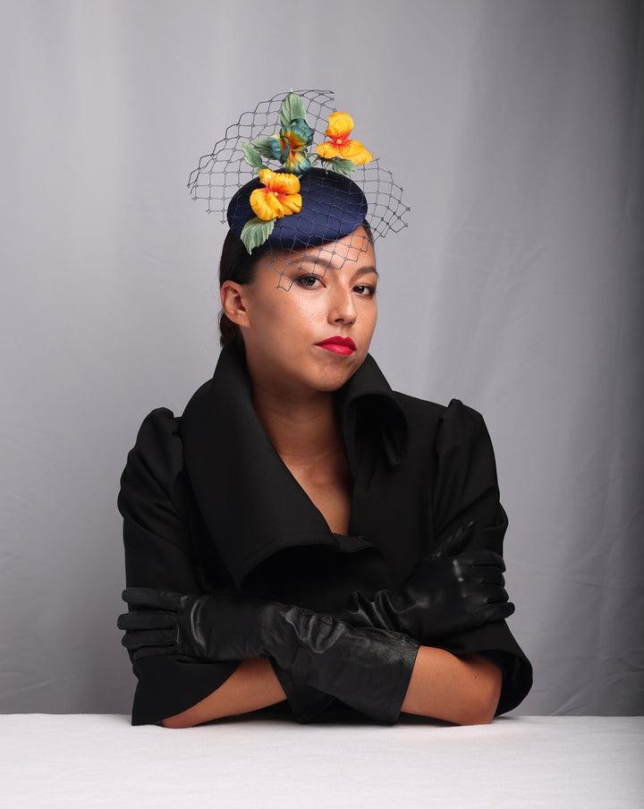 Medium sateen button shaped piece decorated with stiffened baby veil and multi colour violets.