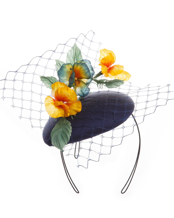 Medium sateen button shaped piece decorated with stiffened baby veil and multi colour violets.