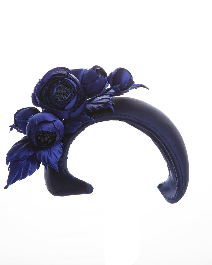 Signature "S" shaped navy sateen headband decorated with wild rose bouquet on the right side.